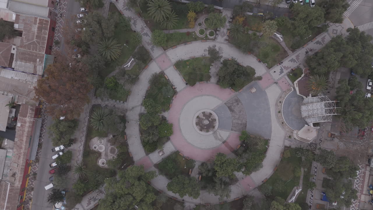 Top down drone shot around the town of Vicuña near Coquimbo in Chile South America with the main square LOG