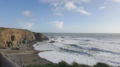 copper coast waterford ireland stage cove incoming tide with waves on a cold winter day
