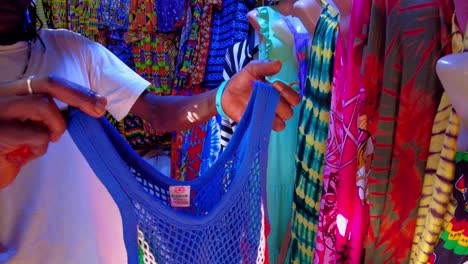 colorful net shirts with gambian flag design at african market