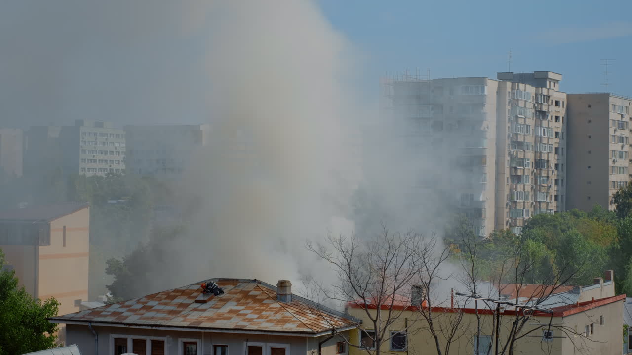 Firefighters going on roof of house to extinguish fire