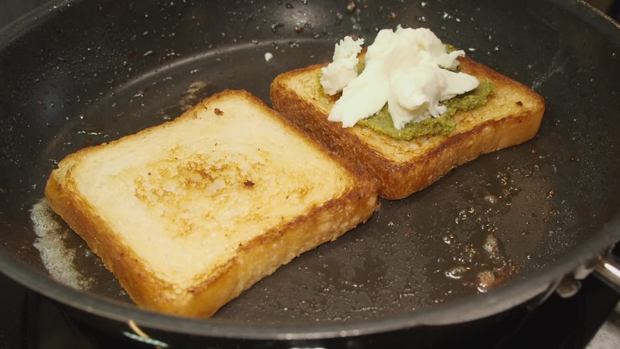Soft Mozzarella cheese added to thick frying sandwich bread in pan