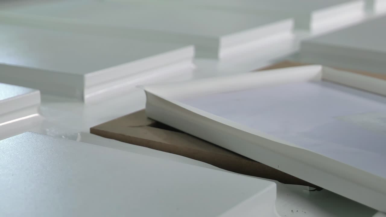 Closeup Of Wood Wrapped With Vinyl PVC Is Cut And Removed From Industrial Press Machine