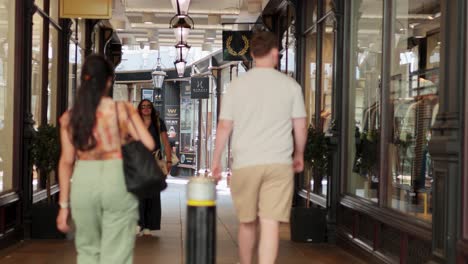 people walking through a shopping arcade