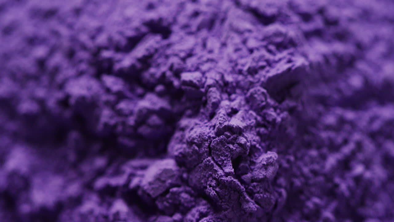 Video of close up of purple powder with copy space