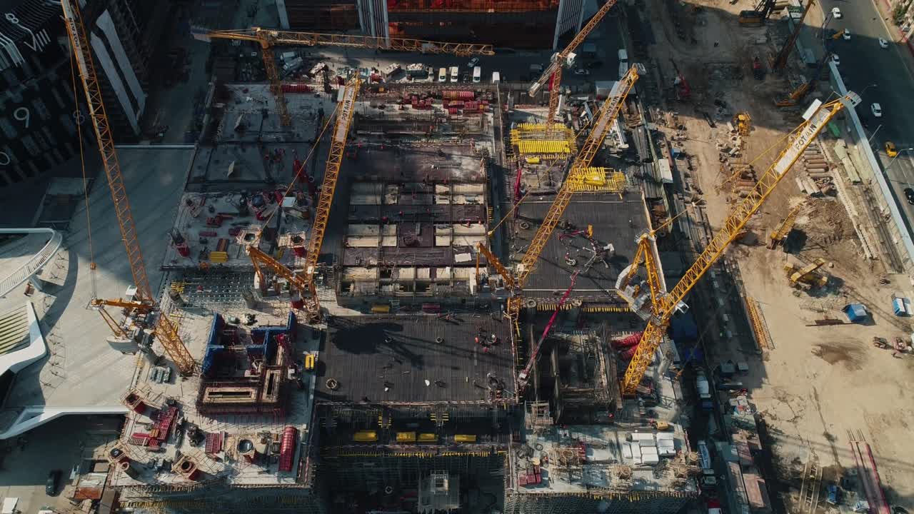 Machinery and building supplies at construction site in city