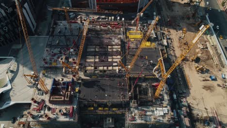 machinery and building supplies at construction site in city