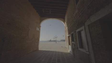 venetian alleyway with canal view