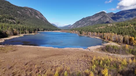 autumn's embrace: mctaggart lakes and the enchanting forested peaks