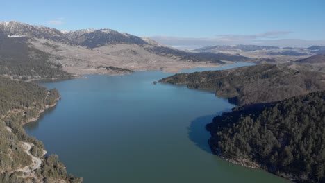 High-altitude-view-Aoos-spring-lake-Epirus-Greece-winter-sunny-day