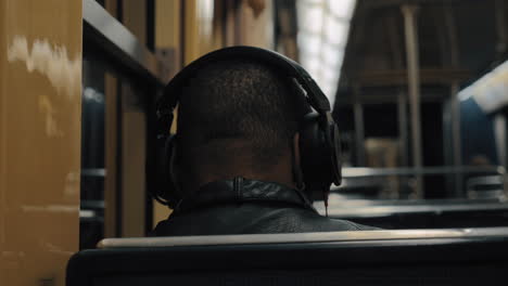 subway commuter enjoying music during the ride