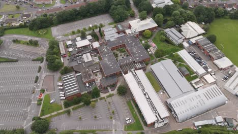 aerial view of a school or college campus with buildings and sports fields