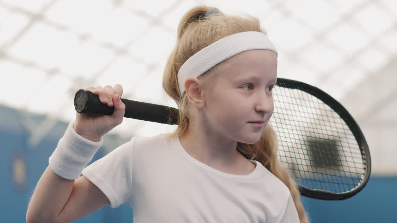 Smiling Little Girl On Tennis Court