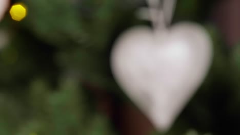 christmas tree decoration shaped as frozen heart, closeup rack focus