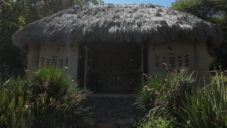 exterior of mountain retreat in peaceful natural surroundings, showcasing rustic charm and tranquility, dolly to front entrance