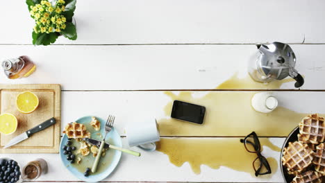 top view man spilling coffee onto mobile phone insurance concept hands from above - red epic dragon