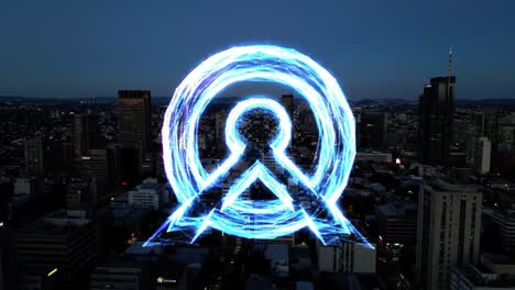 a stunning visual transformation: an urban landscape illuminated by a high-tech, electric logo displaying vibrant energy and modern innovation
