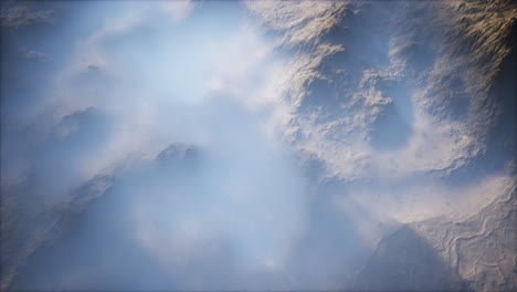 distant mountain range and thin layer of fog on the valleys