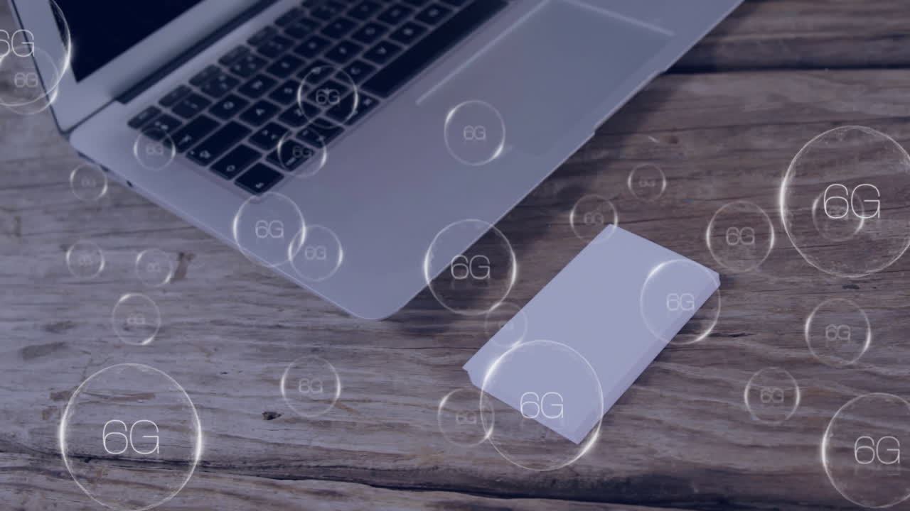 Laptop and card on wooden table with 6G technology animation overlay