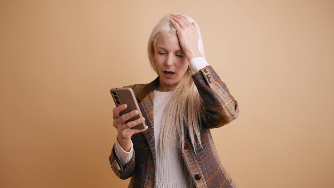 Surprised Woman Reacts to Bad News on Her Smartphone
