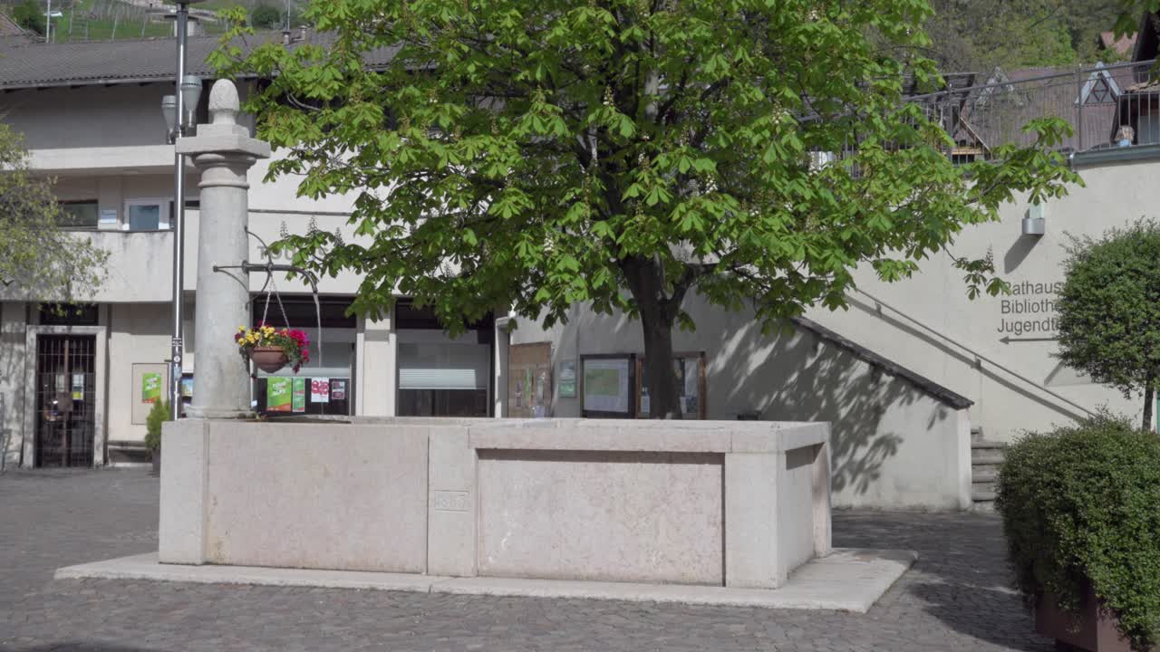 Village fountain in the center in the town center of Kurtatsch - Cortaccia in South Tyrol, Italy