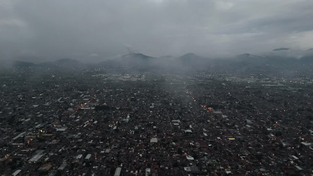 Drone view of low clouds above Ecatepec in Mexico's rainy season