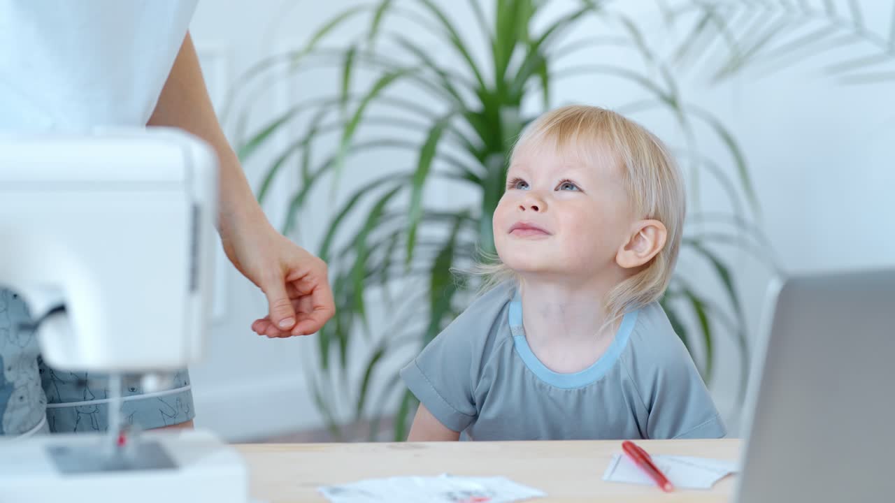 Mother and Child Sewing Together