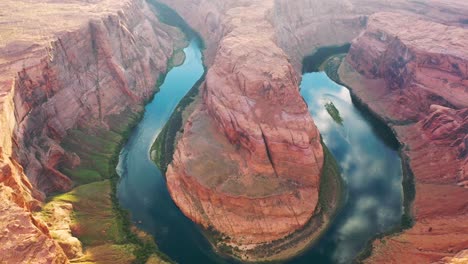 cinematic shot , aerial drone view of famous horseshoe bend on the colorado river and most iconic tourist attraction part of the grand canyon in page arizona