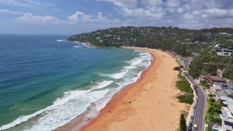 Over-the-road-with-cars-parked-at-Palm-Beach-and-looking-to-the-headland-over-the-surf