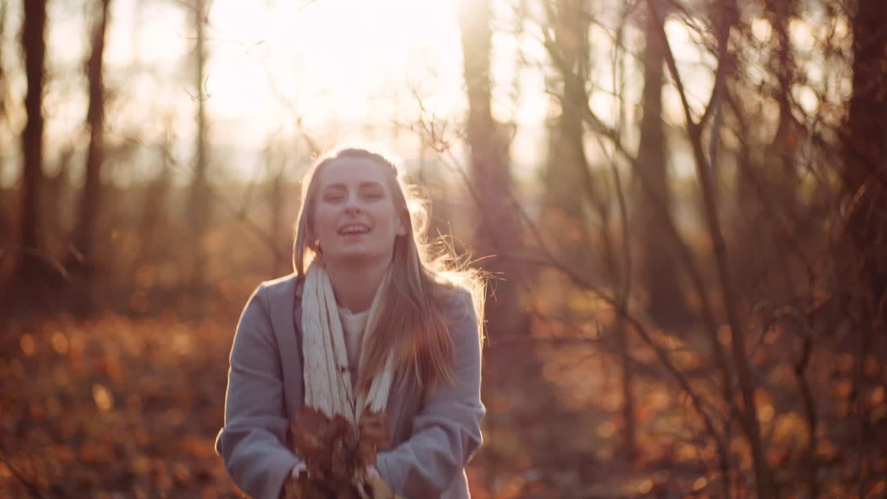 Positive Happy Woman Throwing Leaves In Autumn In Park 4