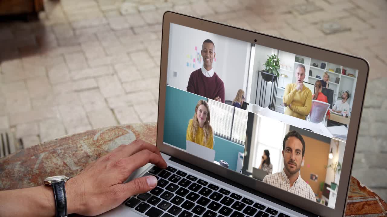 Man having a video conference with multiple people
