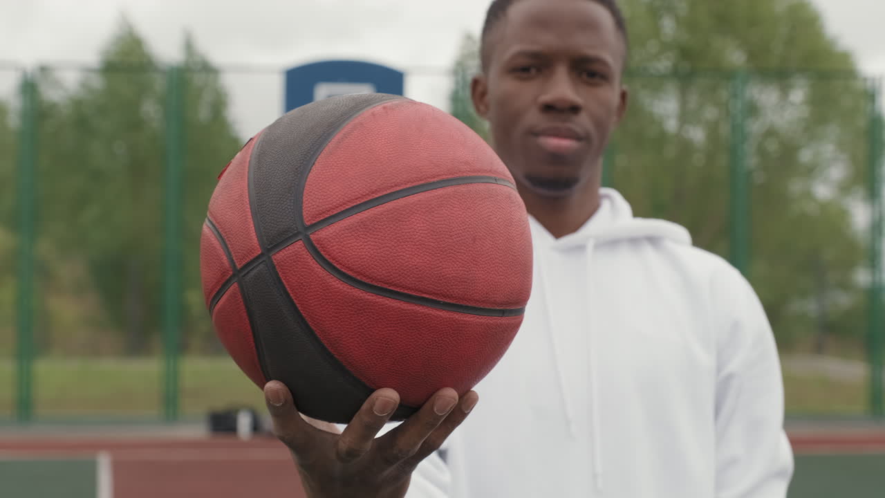 African American Athlete Holding Basketball
