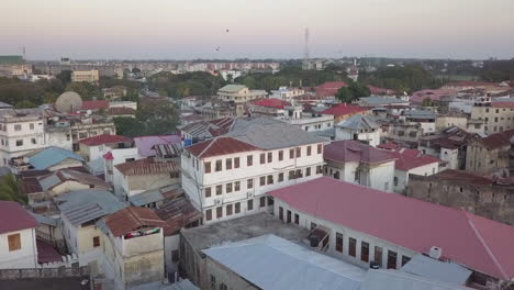 low aerial flight over old zanzibar with new area seen in distance