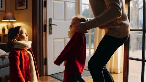 father and daughter getting ready for winter