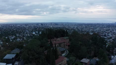 low aerial parallax panning shot of the ornate paramour mansion in hollywood, california. 4k