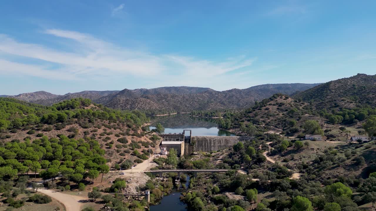 Encinarejo reservoir damhead above River Jandula Sierra de Andujar AERIAL REVEAL