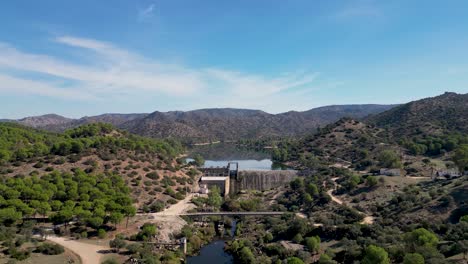 Encinarejo-reservoir-damhead-above-River-Jandula-Sierra-de-Andujar-AERIAL-REVEAL