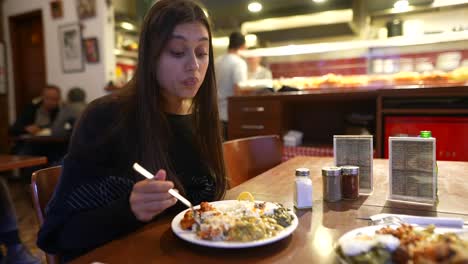 woman enjoying a meal at a restaurant