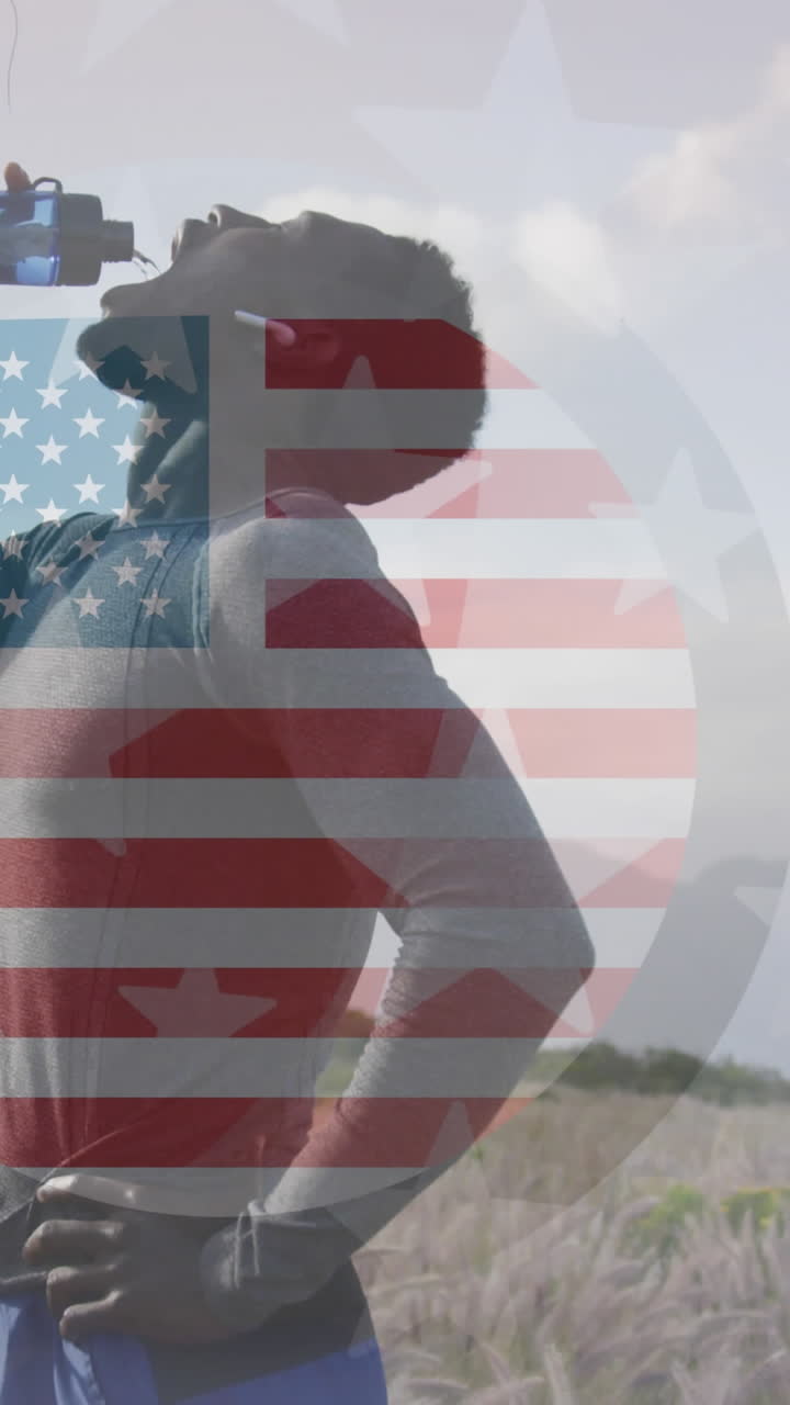 animación de la bandera estadounidense sobre un hombre afroamericano bebiendo agua en las montañas