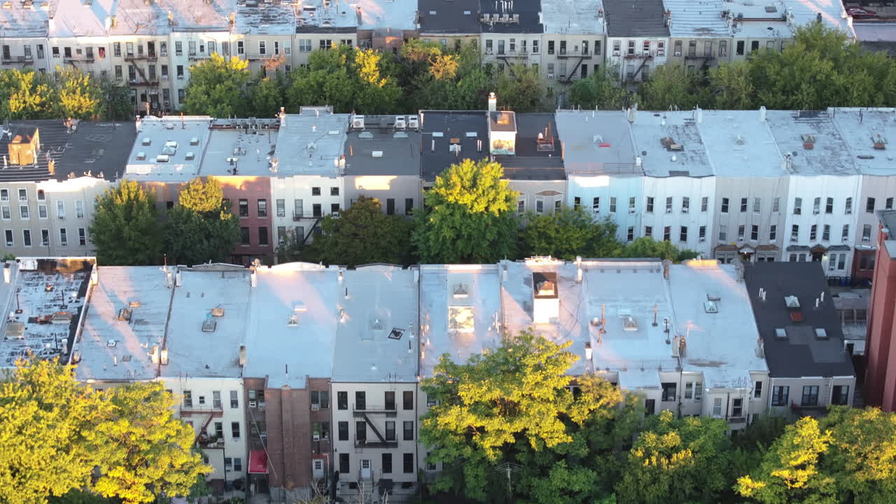 Aerial View of a City Neighborhood with Rows of Houses and Trees