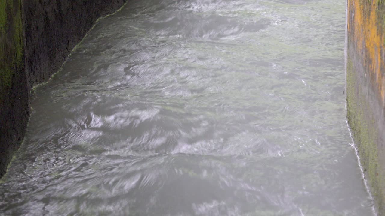 Water flows in a man-made irrigation canal used for agricultural purpose.