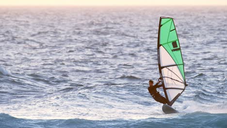 male surfer windsurfing in the beach 4k