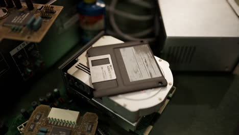 old computer floppy disk and motherboard