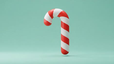 a vibrant red and white candy cane floating against a soft turquoise background, perfect for holiday decorations and celebrations in the festive season