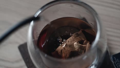 overhead slow motion shot of hot tea with visible steam rising, capturing the warmth and elegance of the moment. ideal for food, beverage, wellness, and cinematic lifestyle visuals.