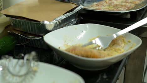 Mixing-chicken-Breast-and-Bread-Crumbs-flour-into-a-bowl-crispy-Homemade-delicious-recipe-detail-shot-flour