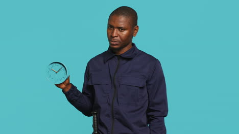 security guard holding clock, rushing people out of property