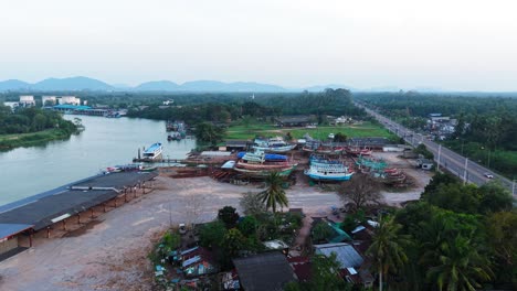 fishing boats at a river dockyard