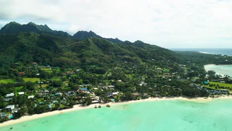 Clouds-meeting-the-mountains-of-Rarotonga,-Cook-Islands-on-a-summers-day