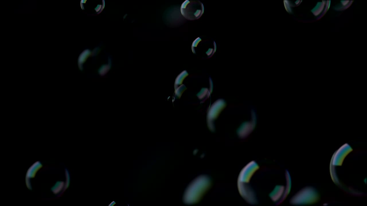 Soap Bubbles. Black Background. Calm Video Background Loop