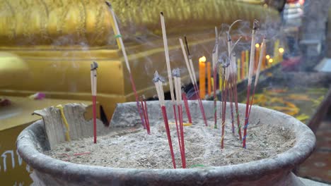 burning incense in a temple in chiang mai, thailand